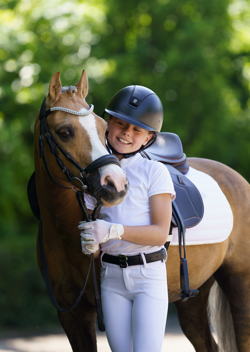 White saddle pad pony dressage